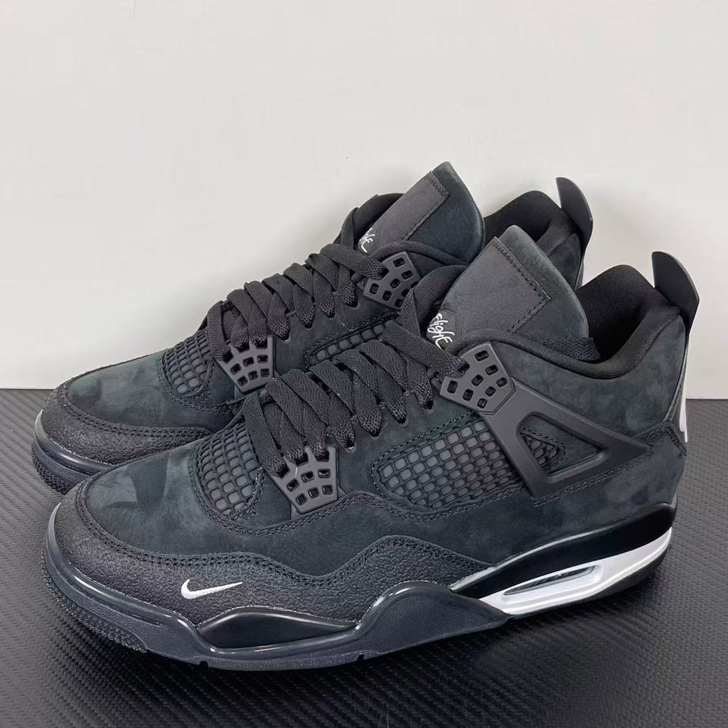 Air Jordan 4 sneakers, dark gray suede with lace-up front, mesh vents, and Air sole