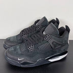 Air Jordan 4 sneakers, dark gray suede with lace-up front, mesh vents, and Air sole