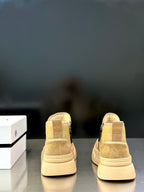 Givenchy sneakers pale yellow with tan panels, heel back view