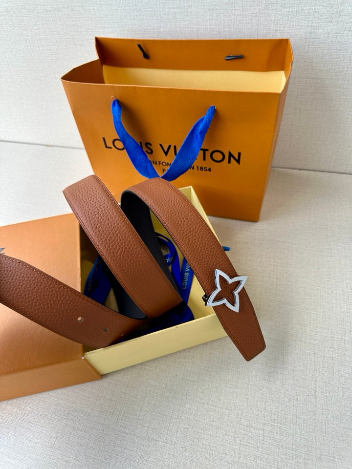Louis Vuitton brown leather belt with star buckle, angled on display