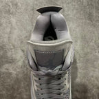 Gray suede sneaker interior opening with cushioned collar and lace loops