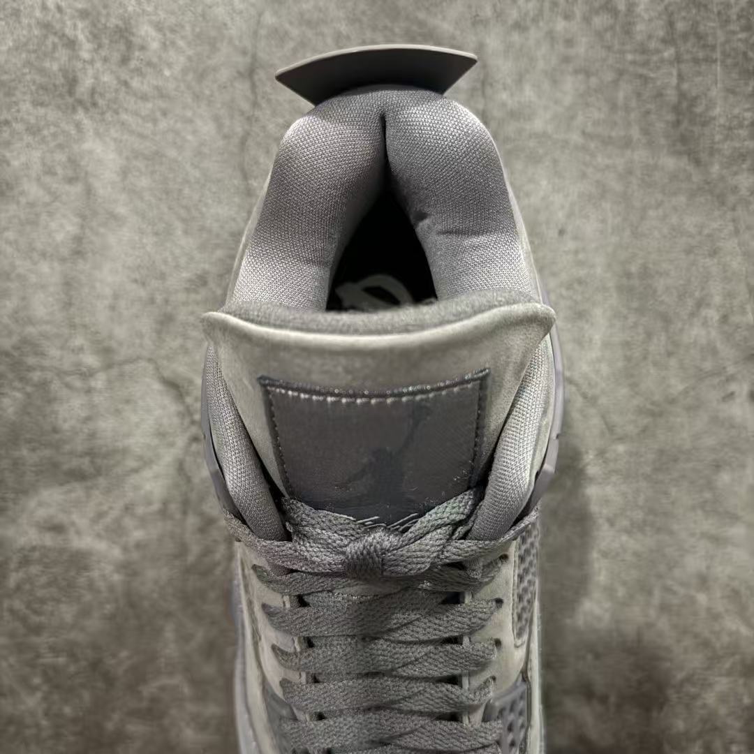 Gray suede sneaker interior opening with cushioned collar and lace loops