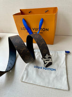 Louis Vuitton monogram belt with dark leather strap and silver-tone buckle hardware