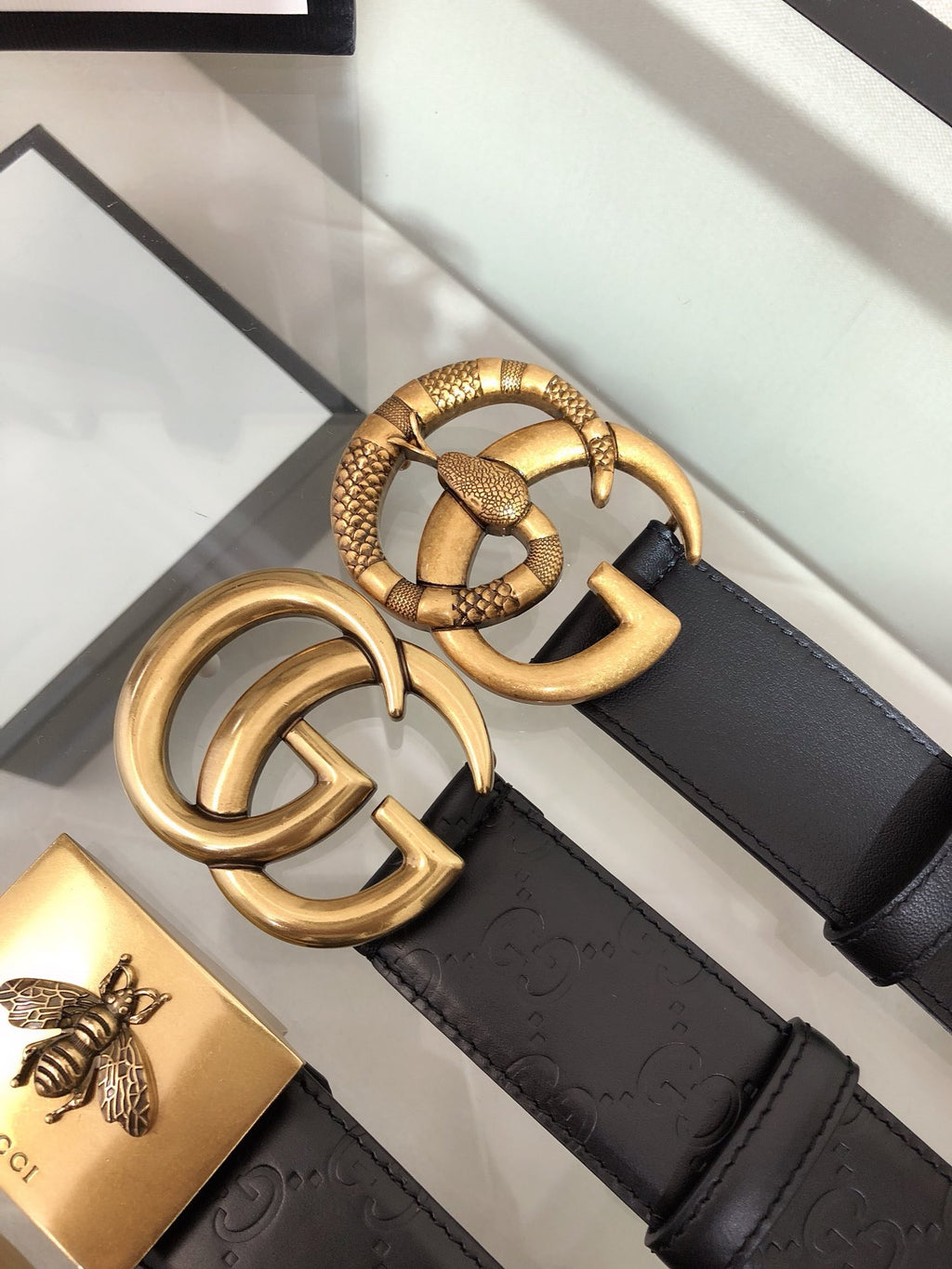 Belt with gold double-ring buckle and black textured strap