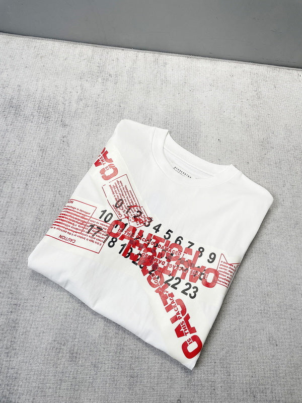 White T-shirt folded, red Maison Margiela number graphic print on chest