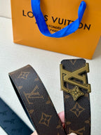 Louis Vuitton monogram belt with gold buckle and dark patterned leather strap