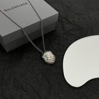 Round logo pendant necklace with silver-tone chain and gift box