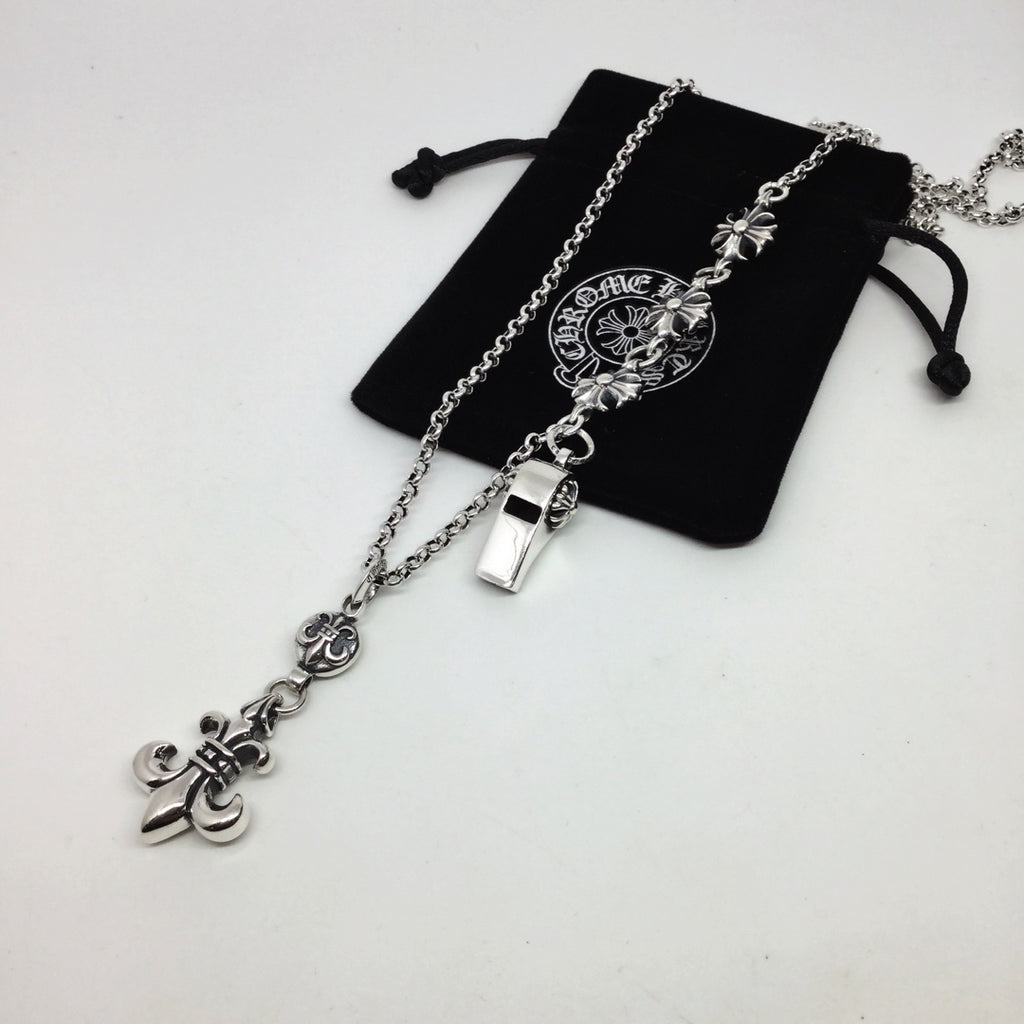 Silver chain necklace with small lock and fleur-de-lis charms, with black pouch
