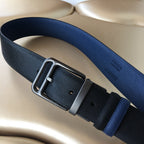 Prada belt with metal buckle and two-tone navy webbing strap with adjustment holes