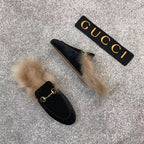 Black velvet loafer slides with beige faux fur cuff and gold-tone ring detail