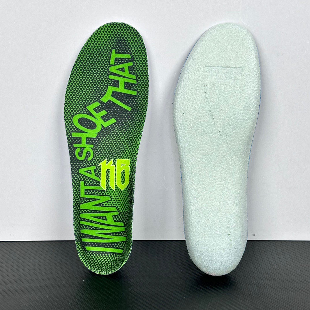 Shoe insoles: white insole sole and green printed insole with partial lettering.