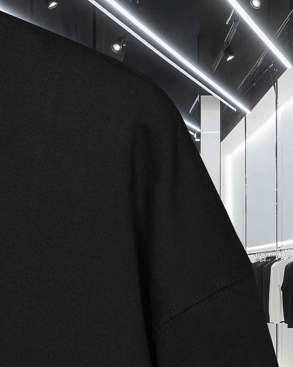 Black sweatshirt fabric with visible shoulder seam