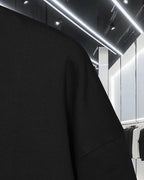 Black sweatshirt fabric with visible shoulder seam
