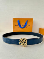 Louis Vuitton belt, dark blue embossed leather with gold-tone knot buckle