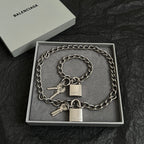 Silver-tone chain bracelet with two key charms and padlocks, in a gift box