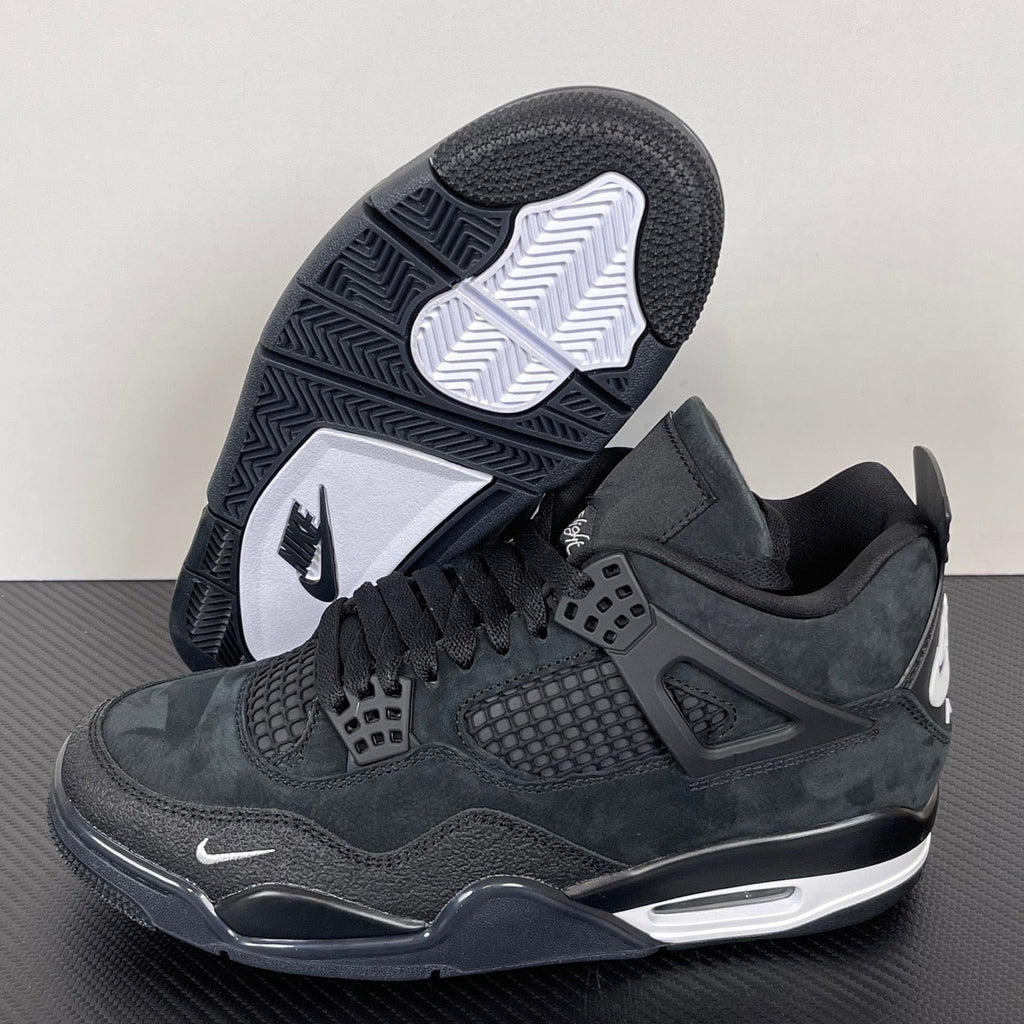 Air Jordan 4 sneakers with dark rubber outsole tread and white Jordan wing logo