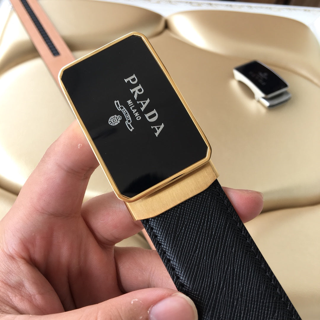 Prada belt buckle showing Prada logo on dark plate with gold-tone frame
