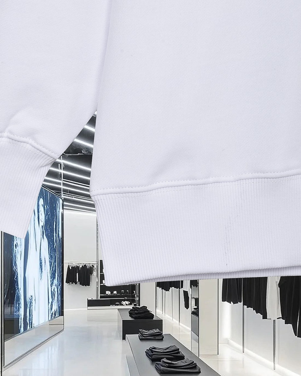 White sweatshirt hem and ribbed cuff with stitched seam detail