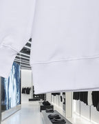 White sweatshirt hem and ribbed cuff with stitched seam detail