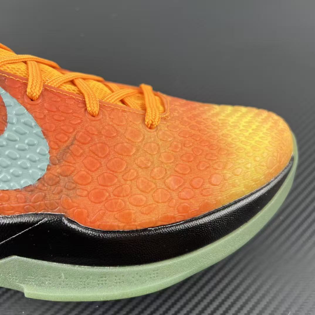 Basketball shoe upper in orange-to-yellow gradient with textured pattern