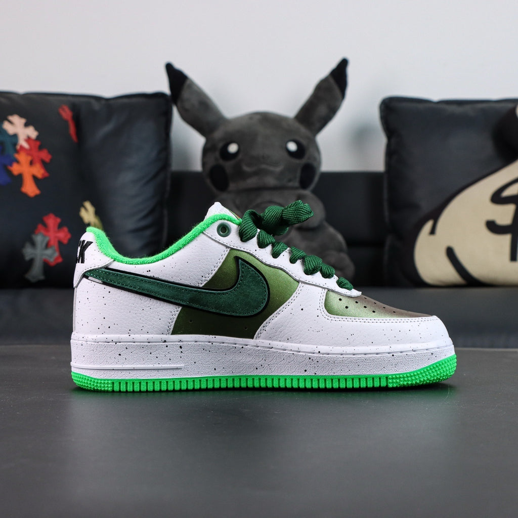 Air Force 1 sneakers, white leather with dark green swoosh; green outsole and laces.