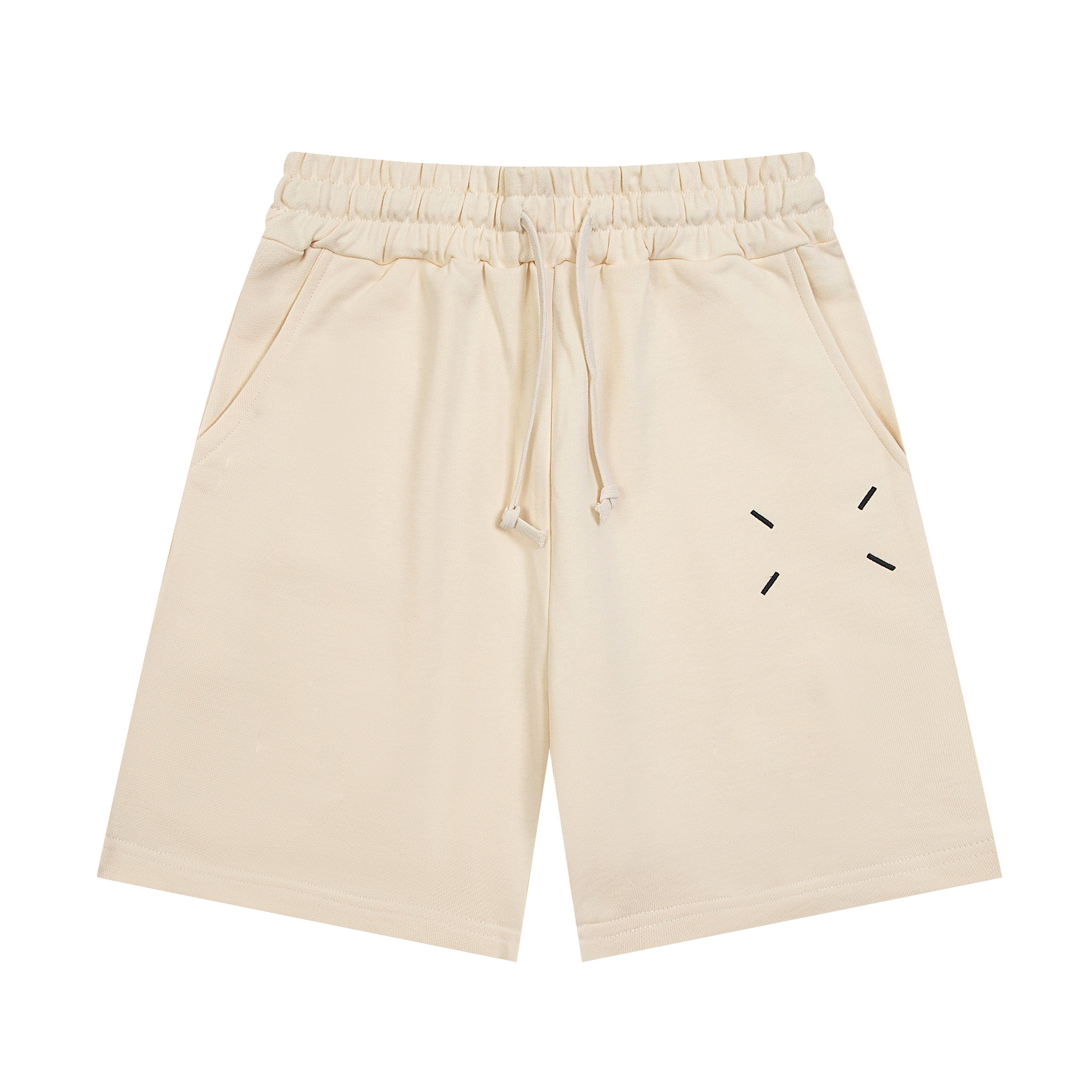 Light beige Maison Margiela shorts with elastic waistband, drawstring, and dash graphic.