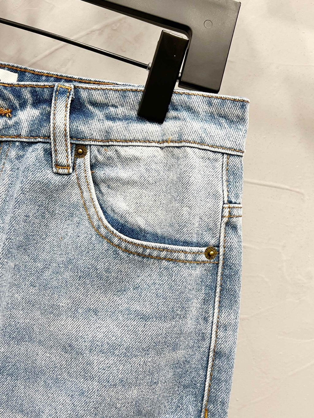 Maison Margiela denim jeans front pocket and fly with light wash and gold button