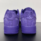 Purple low-top sneakers with lace-up closure and “24” heel detail