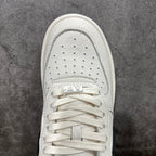 White leather sneaker with lace-up vamp and perforated toe box