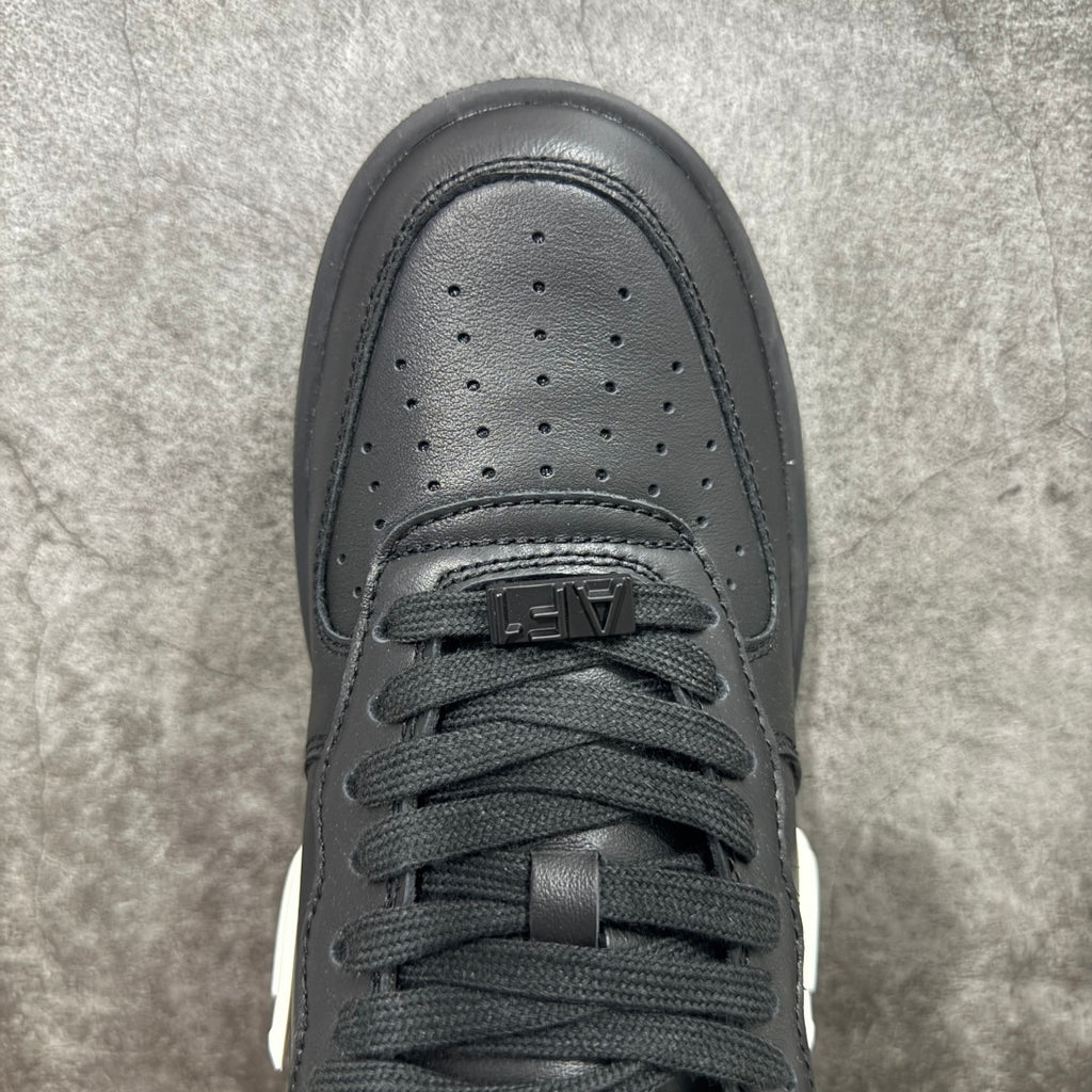 Black sneaker toe box with perforations and lace eyelets