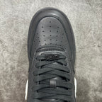Black sneaker toe box with perforations and lace eyelets