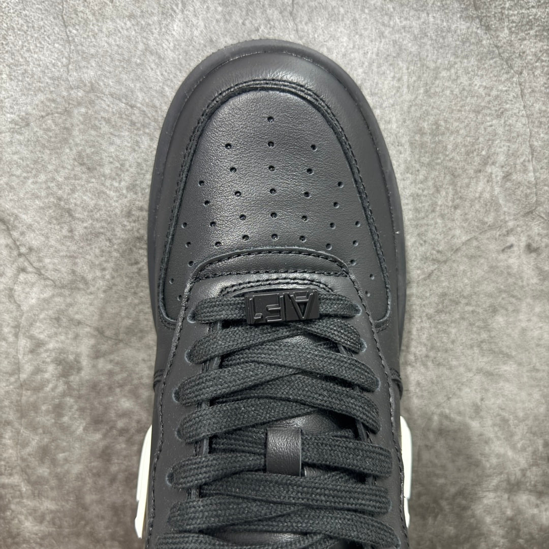 Black sneaker toe box with perforations and lace eyelets