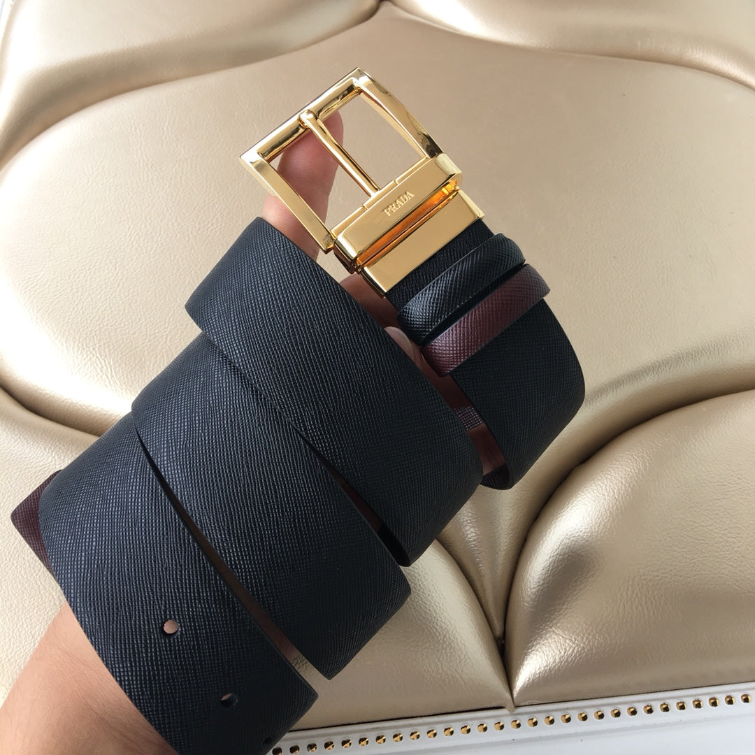 Leather belt with gold buckle and layered strap ends