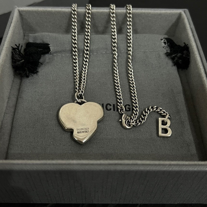 Heart and letter pendant necklaces with silver chains in gray gift box