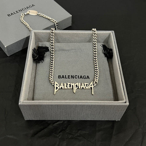 Silver metal chain necklace with Balenciaga logo charm pendant, in gift box