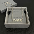 Balenciaga metal charm necklace with silver chain in gift box