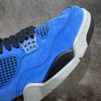 Air Jordan 4 sneakers close-up of blue suede upper, clear lattice detail, white midsole