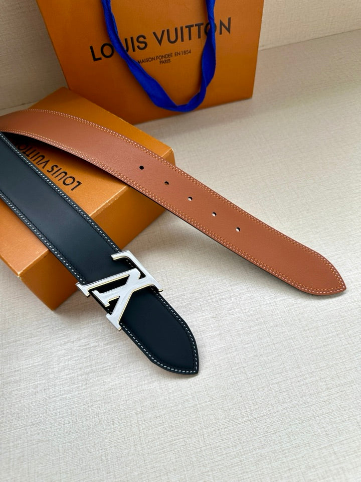 Louis Vuitton belt pair, dark blue and tan straps with silver LV buckle hardware