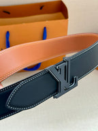 Louis Vuitton belt buckle close-up with dark blue strap and white contrast stitching