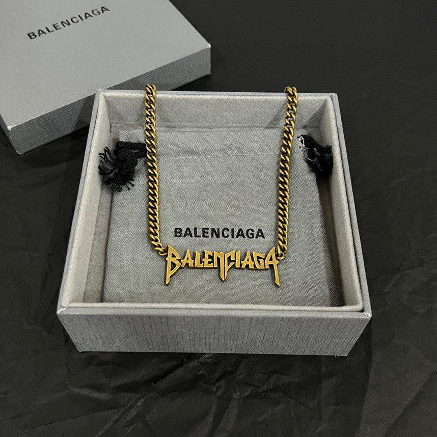 Balenciaga gold chain necklace in gift box with charm details and branded tag
