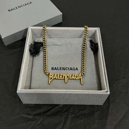 Balenciaga gold chain necklace in gift box with charm details and branded tag