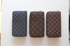 Louis Vuitton small zip pouches: gray checker, brown monogram, and brown checker