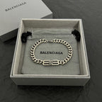 Chain bracelet in box with engraved center links, silver-tone
