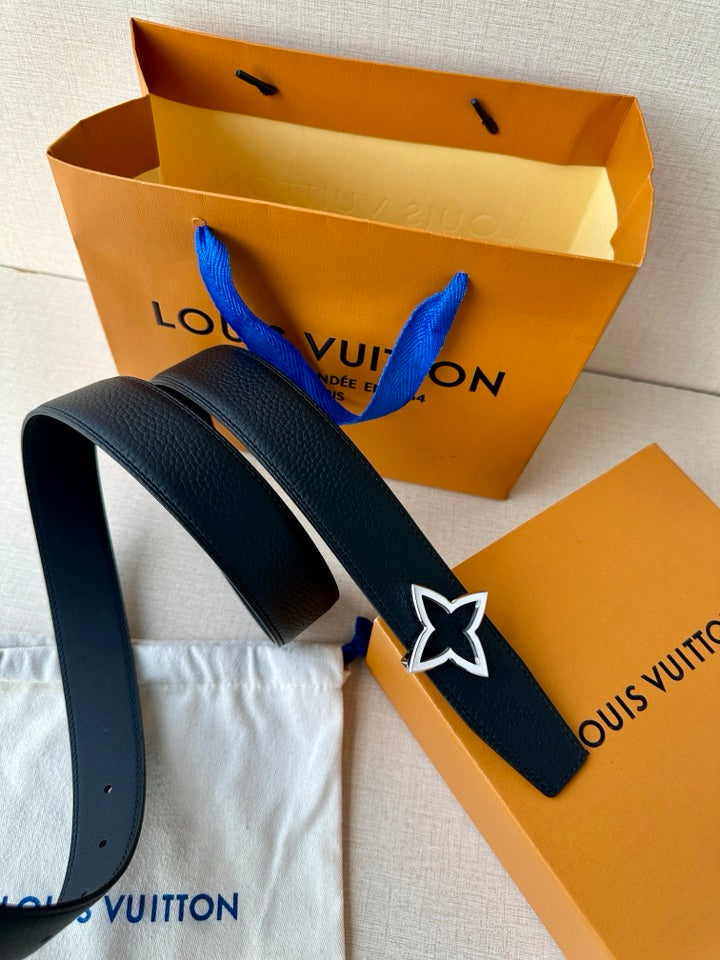 Navy leather belt with star emblem buckle and blue tie detail