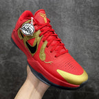 Red basketball shoe with gold panels, black logo, and lace-up front