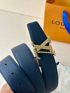 Louis Vuitton leather belt dark blue with gold-tone buckle; side shows belt holes