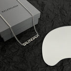 Silver Balenciaga logo pendant necklace with link chain