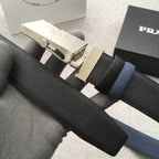 Textured dark belt with gold buckle and two-piece keeper tabs