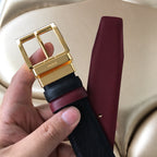 Prada belt buckle close-up, dark textured strap with burgundy leather