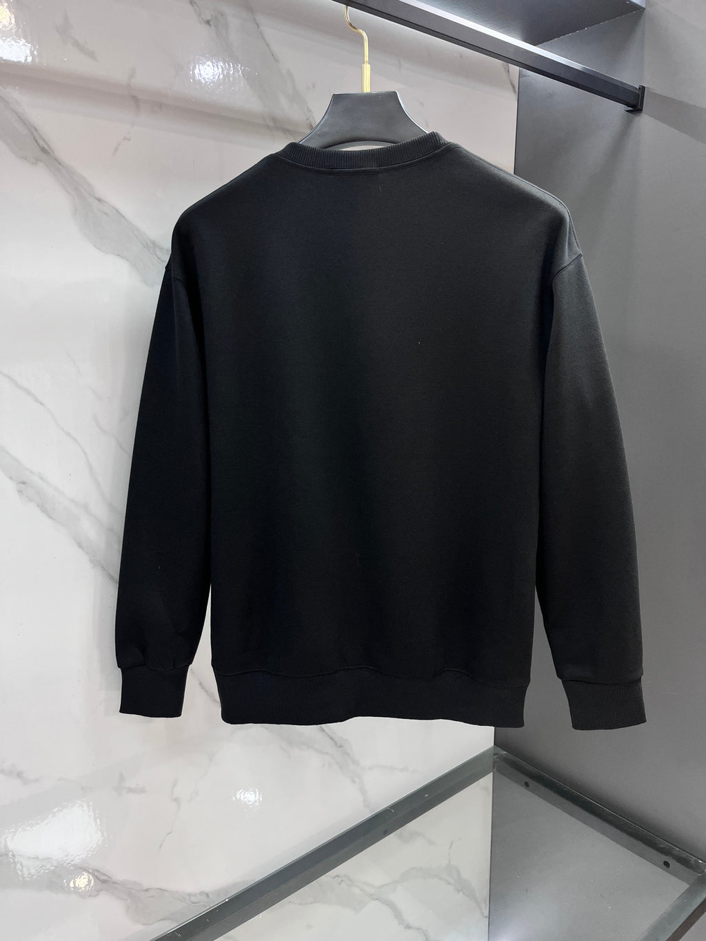 Black crewneck sweatshirt, plain back with ribbed cuffs
